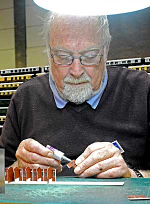 A photo of Jeremy Dennis modelling a GWR slip coach.