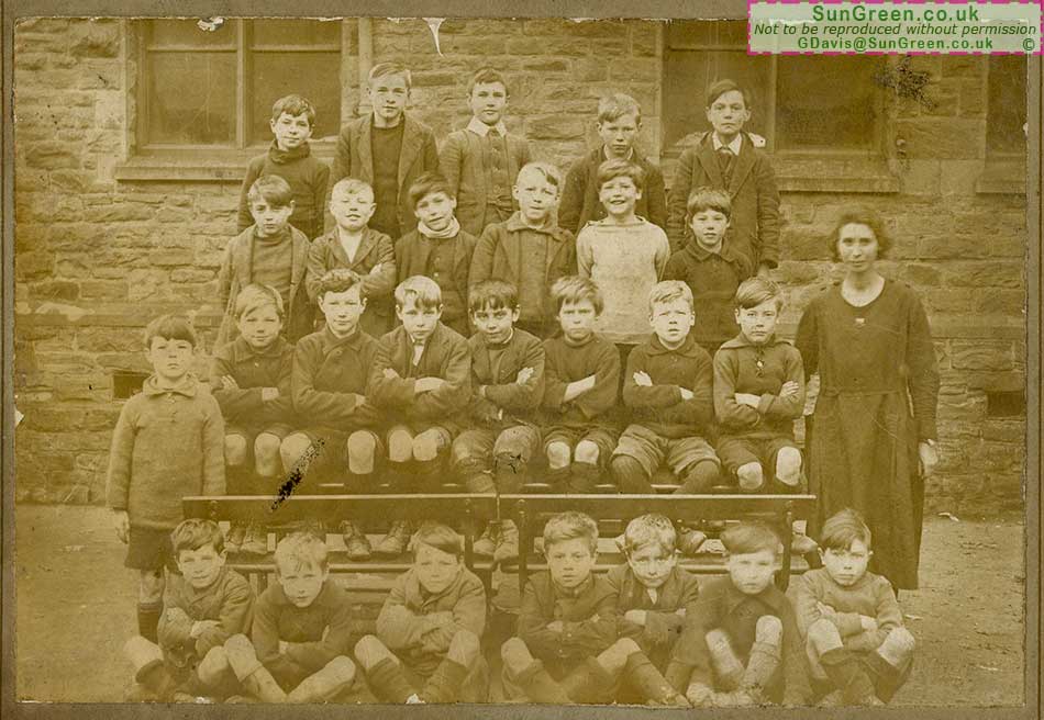 A photo of boys and a teacher at Pillowell school