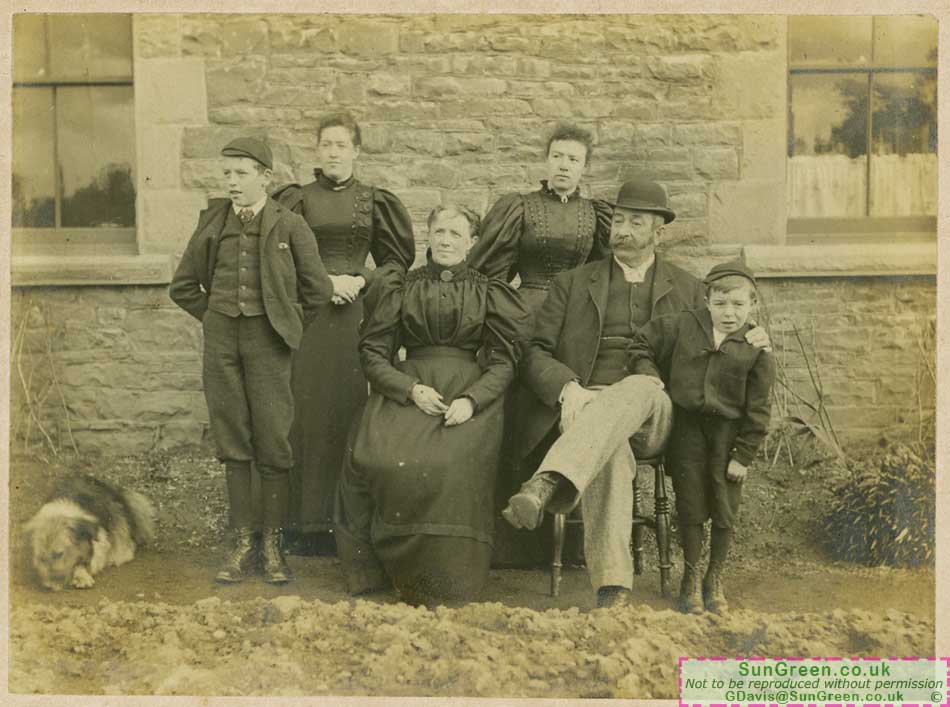 An old photo of a fmaily taken outside Black Rock Farm near Lydney.