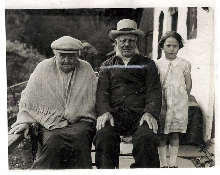 A photo of James and Annis Morse and a grandchild? taken at Milcombe Head.