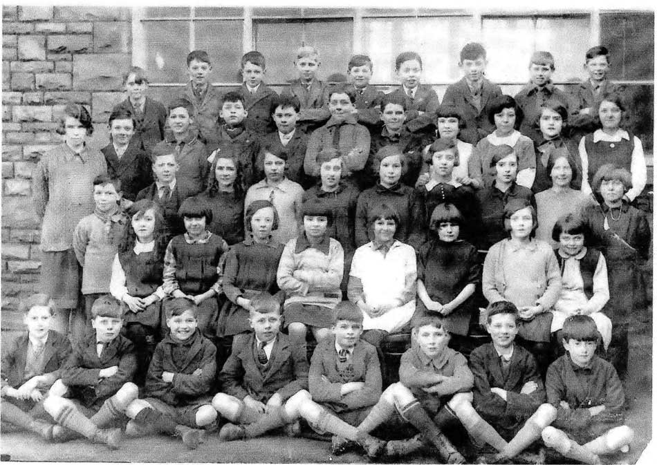 A photo of a class of pupils and their teacher taken in Lydney in 1928